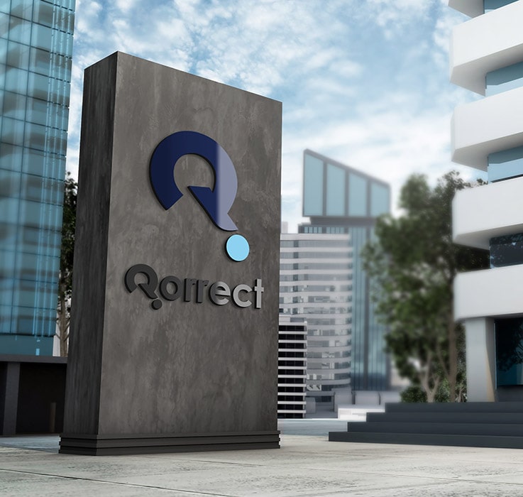 Qorrect assessment system logo on a wall